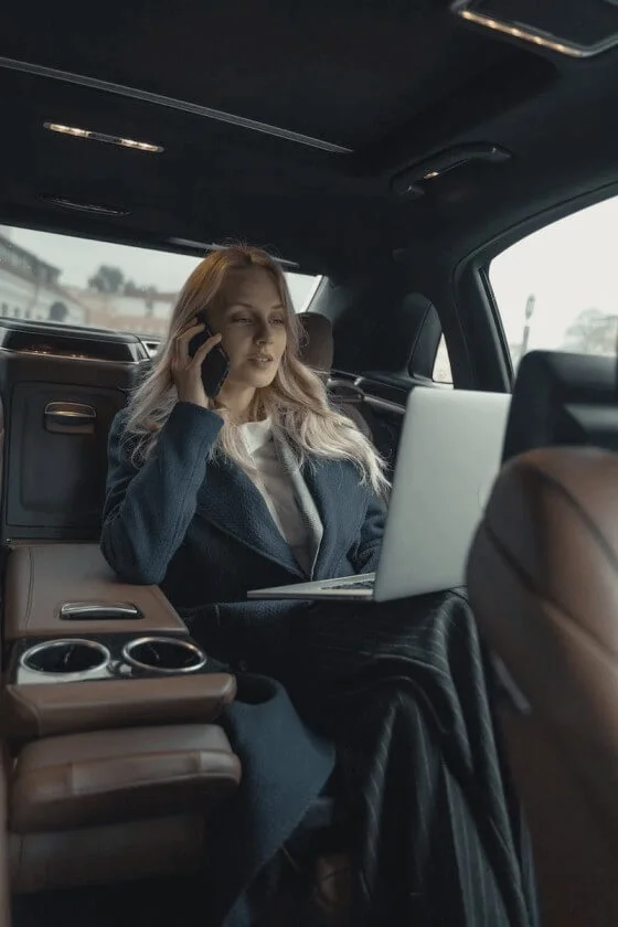 professional lady on phone in a car